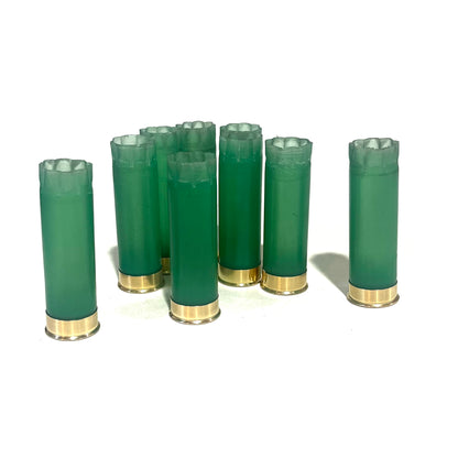 8 light green 12 gauge shotgun shell hulls with gold bases, standing upright with crimped star-fold tops