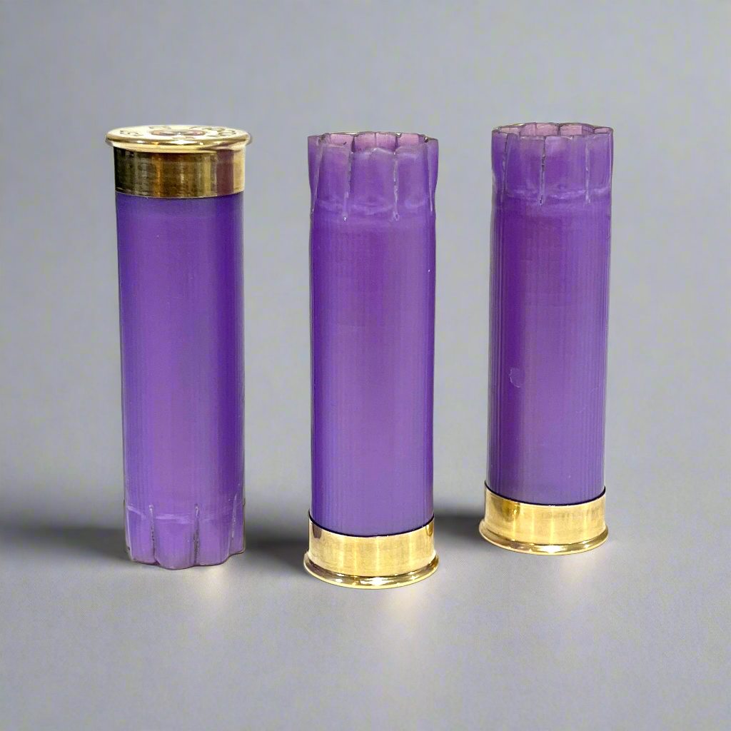 Three light purple shotshells standing upright, two showing open crimped tops, on a gray background for weddings