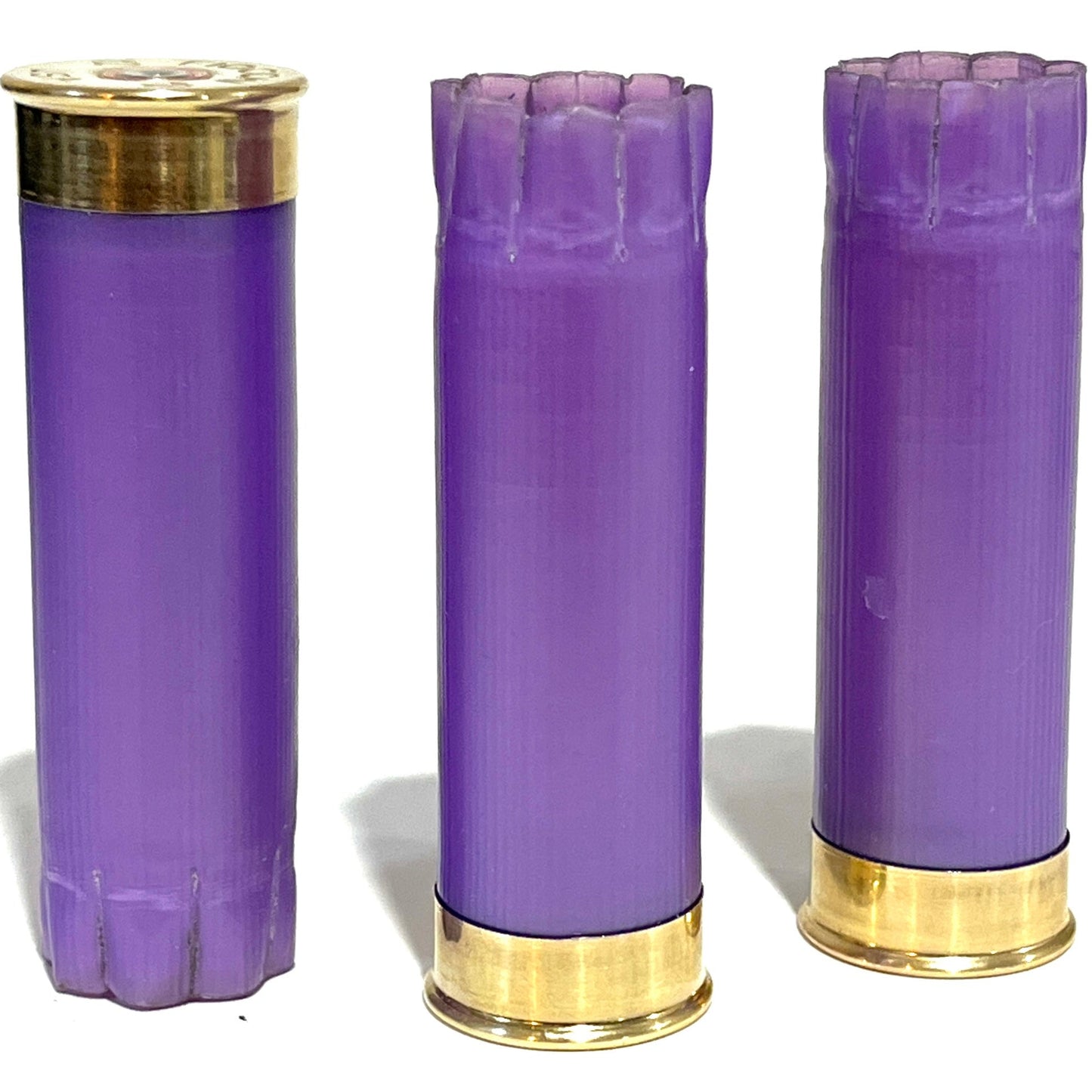 Three light purple hulls standing upright, two with open crimped tops, on a white background