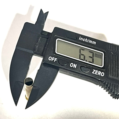 Digital caliper measuring a drilled .22 Hornet brass casing at 6.3 mm
