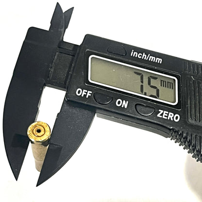 Digital caliper measuring the diameter of a drilled .22 Hornet brass casing at 7.5 mm