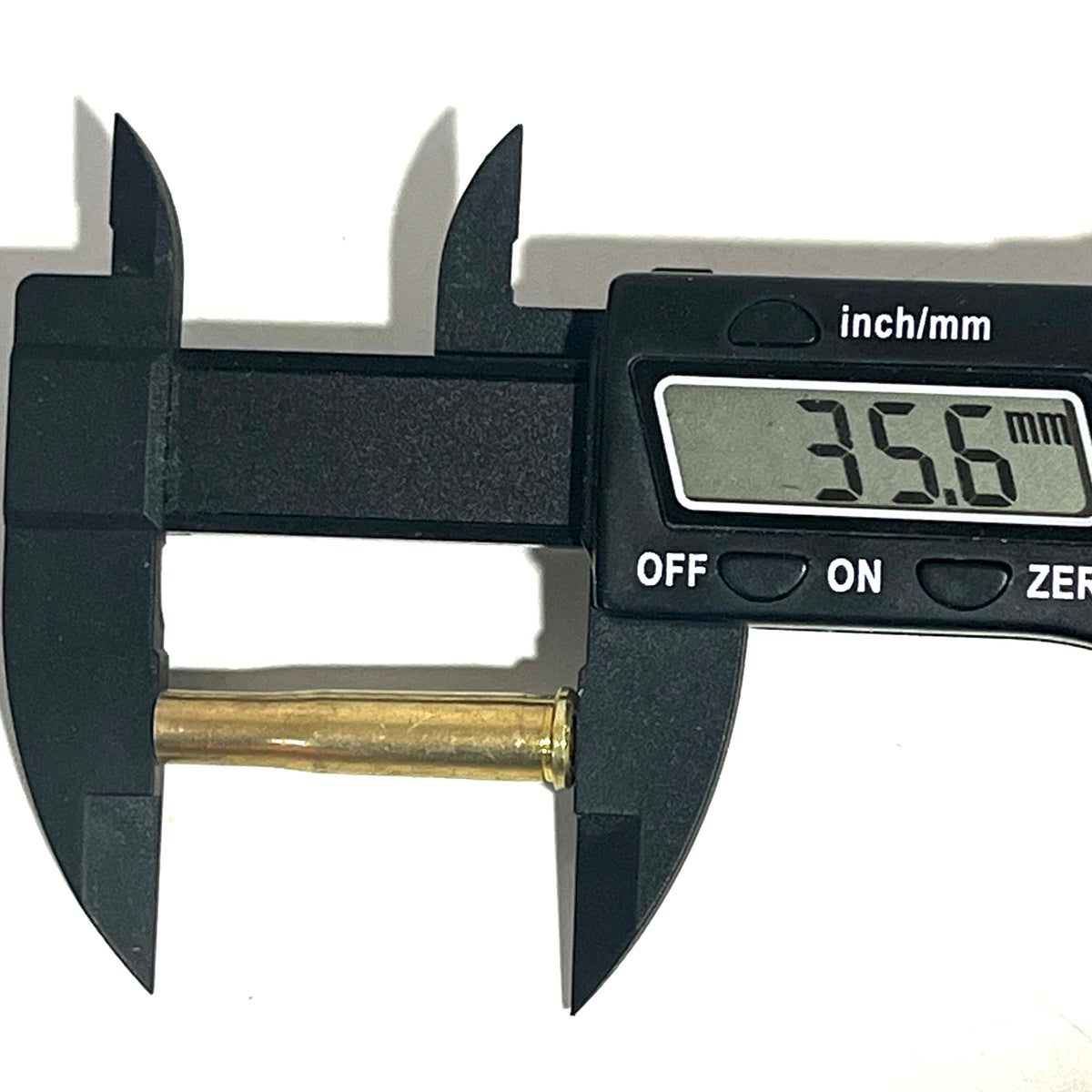 Digital caliper measuring the length of a .22 Hornet brass shell casing at 35.6 mm