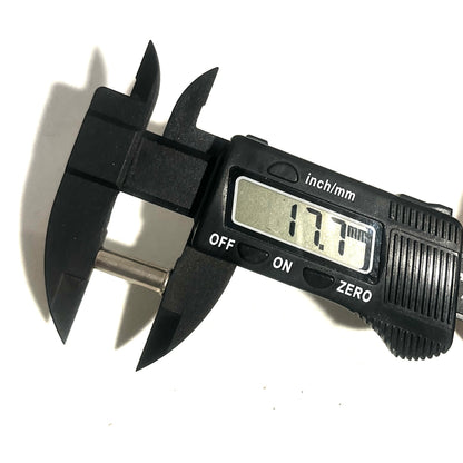 Digital caliper measuring the length of a nickel 22 caliber casing showing 17.7 mm