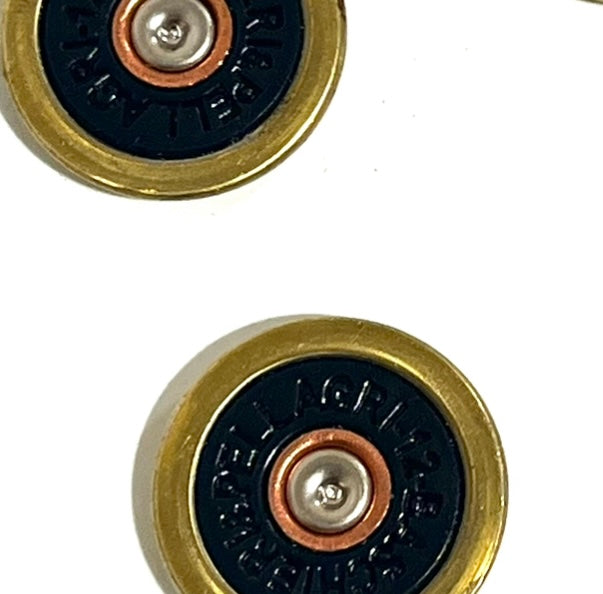 2 navy blue Baschieri & Pellagri 12 gauge shotgun shell slices with brass rims, close-up view