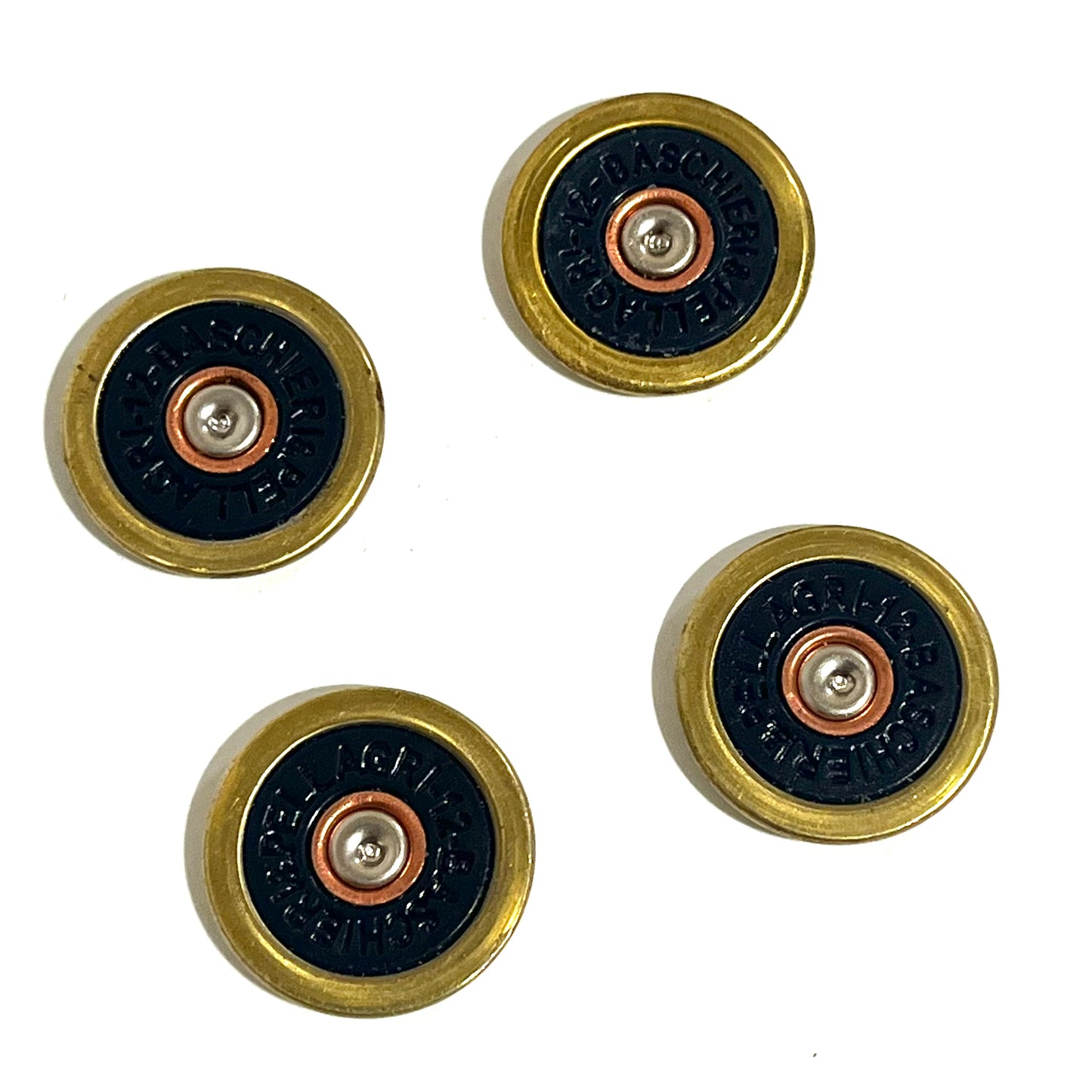 4 navy blue Baschieri & Pellagri 12 gauge shotgun shell slices with brass rims scattered on a white background