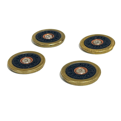 4 navy blue Baschieri & Pellagri 12 gauge shotgun shell slices with brass rims scattered on a white background