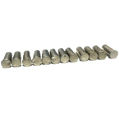 12 nickel 22 caliber empty casings standing in a row showing headstamps on a white background