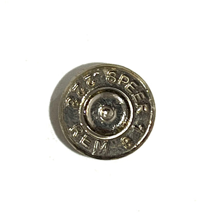 Close-up of one polished nickel 223 5.56 bullet slice showing Speer Rem headstamp markings