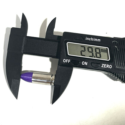Digital caliper measuring the length of a nickel 9mm Luger cartridge with purple tip showing 29.8 mm