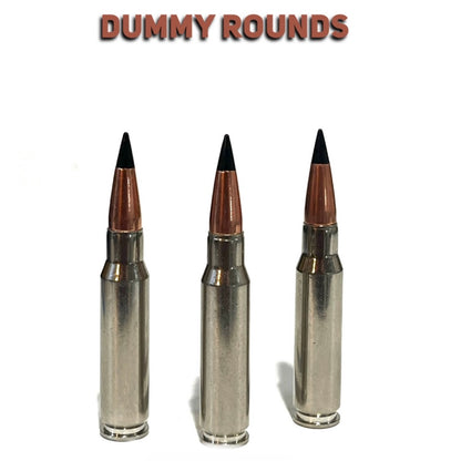 Three nickel .308 dummy rounds standing upright with black polymer tips on a white background