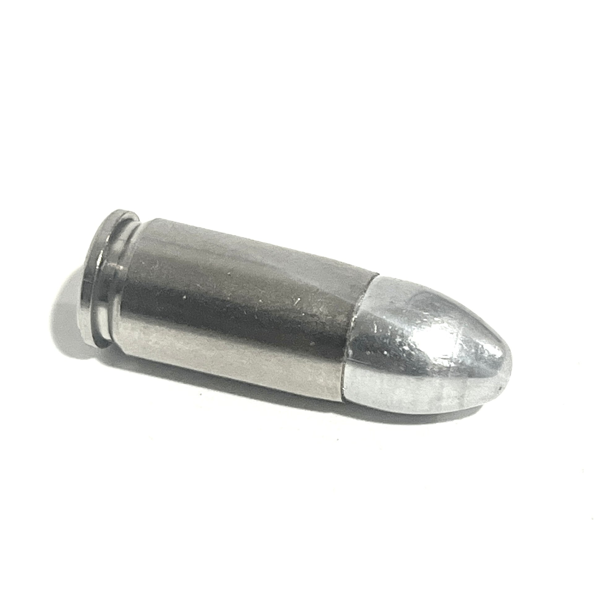 A single nickel 9mm cartridge lying on its side against a white background.