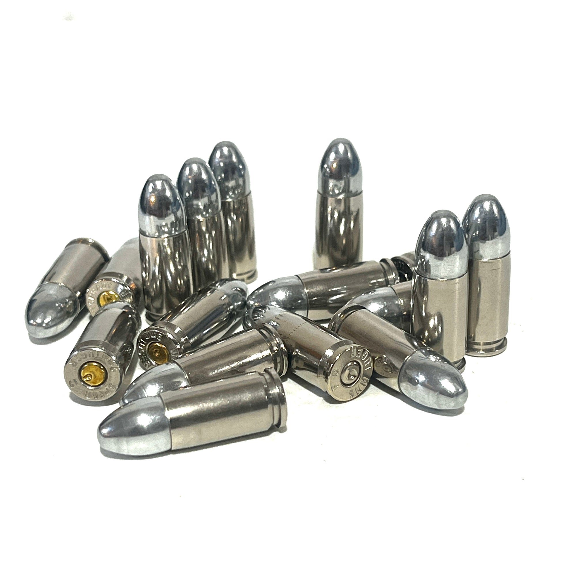 A jumbled pile of nickel 9mm casings with silver bullets, some showing brass primers.