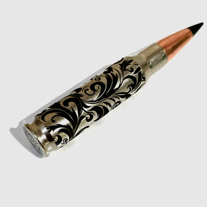 Baroque engraved bullet casings with black tips, designed as sophisticated, safe collector's items for display.