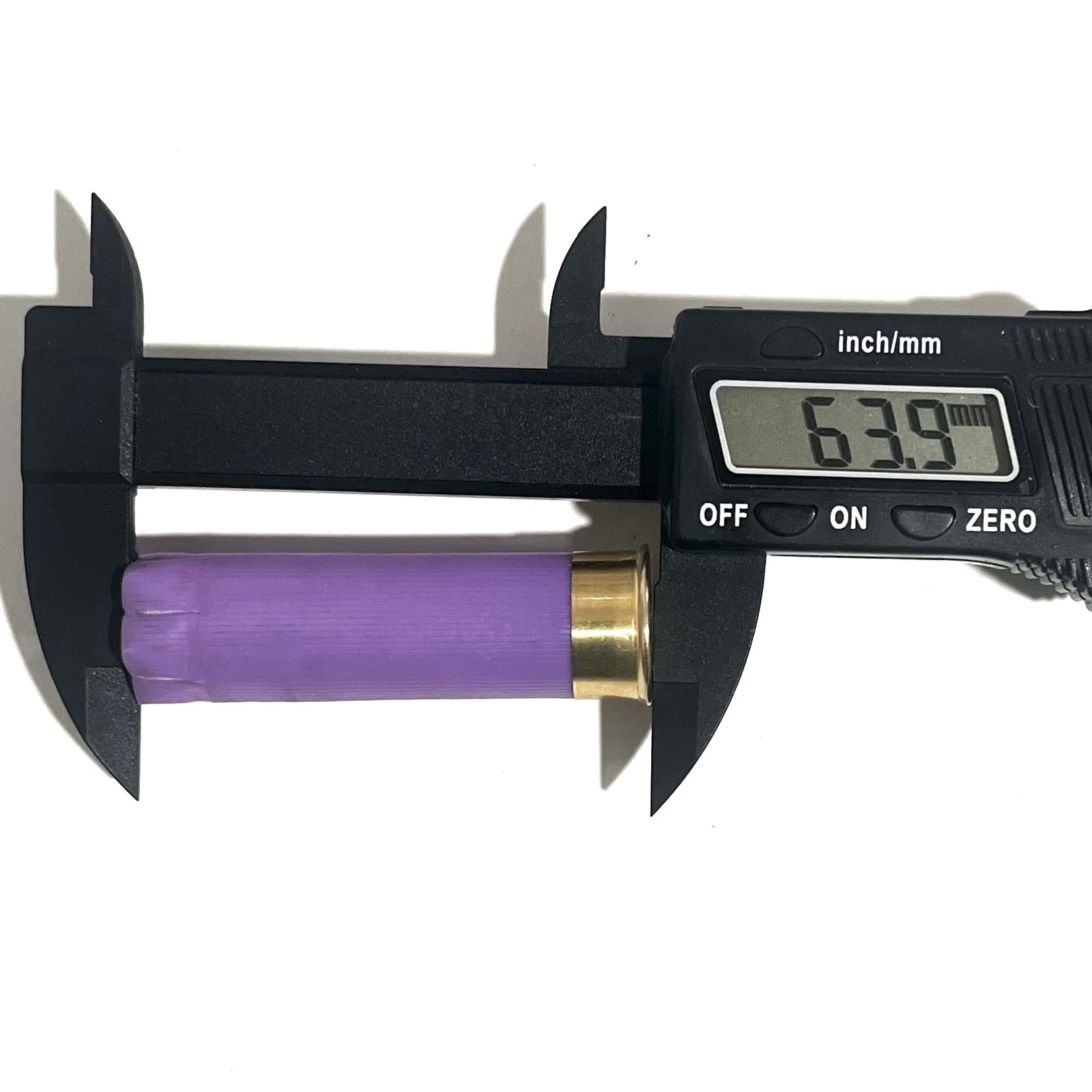 Digital caliper measuring the length of a purple 16 gauge shotgun shell hull at 63.9 mm