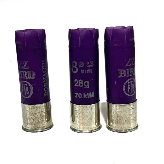 Three purple Bornaghi shotgun shells with silver high brass bottoms marked ZZ Bird 8 28g 70mm