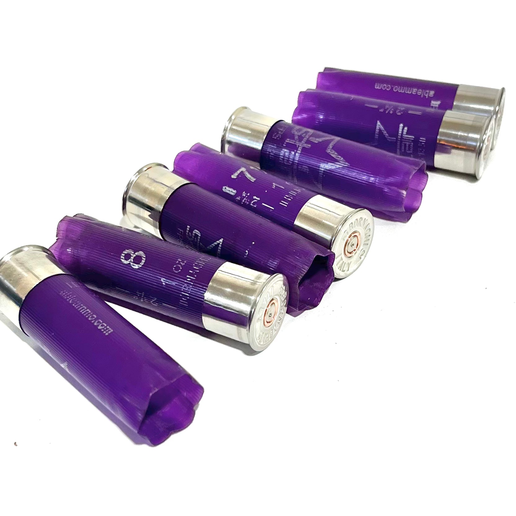 6 purple Bornaghi 12 gauge shotgun shells lying diagonally on a white background