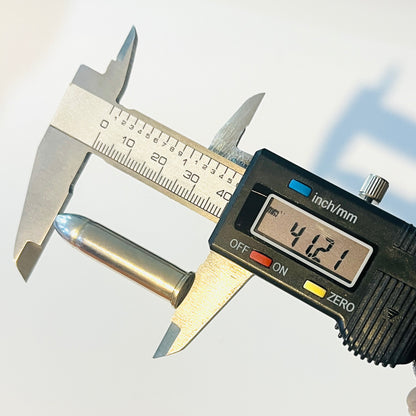 Digital caliper measuring the length of a nickel 357 Magnum realistic dummy round at 41.21 millimeters