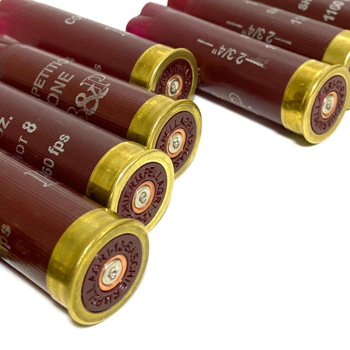 4 burgundy red empty 12 gauge shotgun shell hulls with brass headstamps