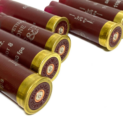 4 burgundy red empty 12 gauge shotgun shell hulls with brass headstamps