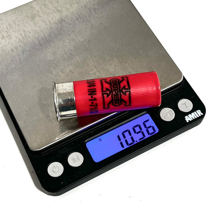 Single red spent shell resting on a digital scale showing a 10.96 gram weight reading