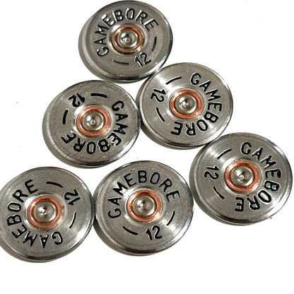 6 round silver Gamebore 12 gauge shotgun shell slices with copper primer centers arranged in a cluster