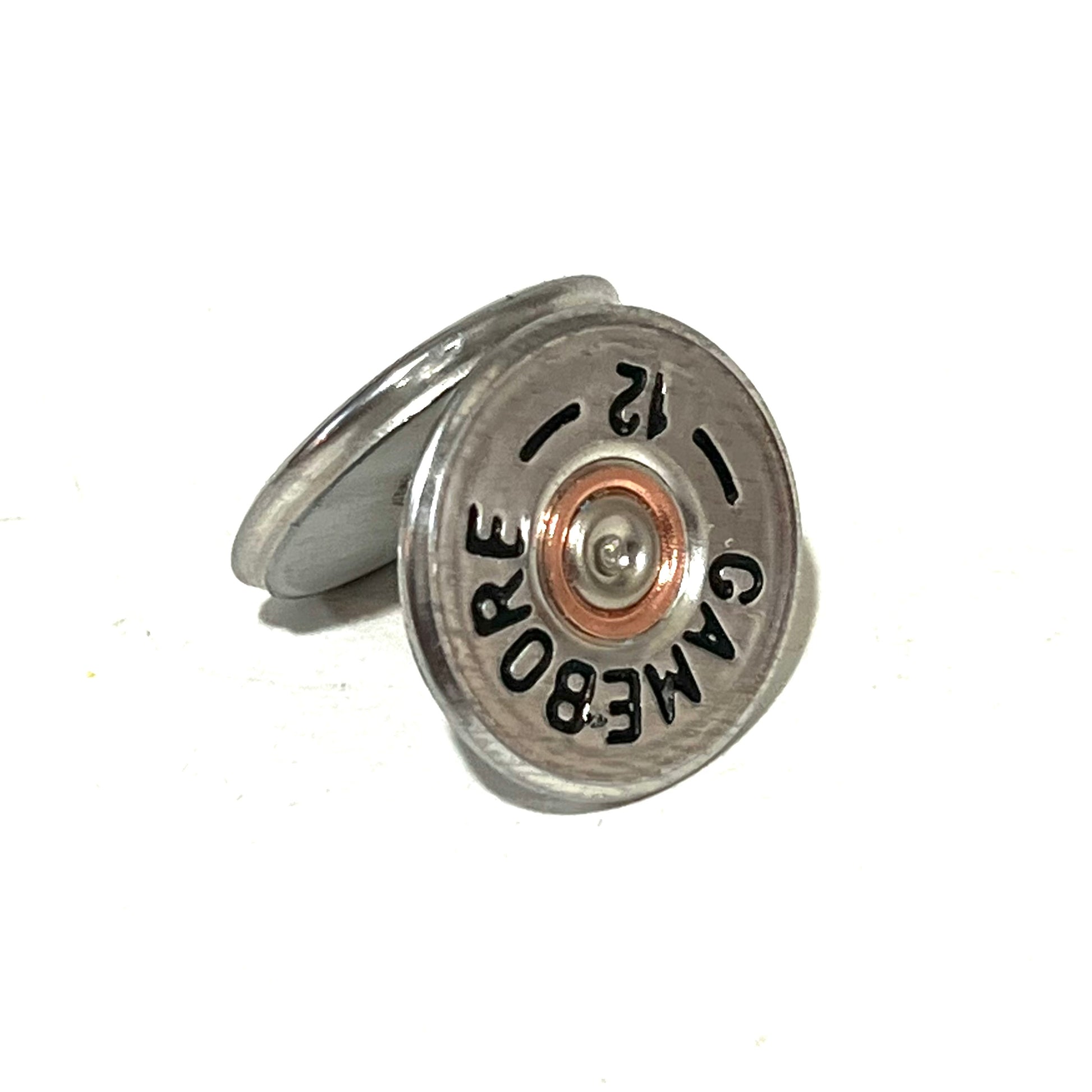 2 round silver Gamebore 12 gauge shotgun shell slices, one leaning against the other showing headstamp text