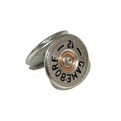 2 round silver Gamebore 12 gauge shotgun shell slices, one leaning against the other showing headstamp text