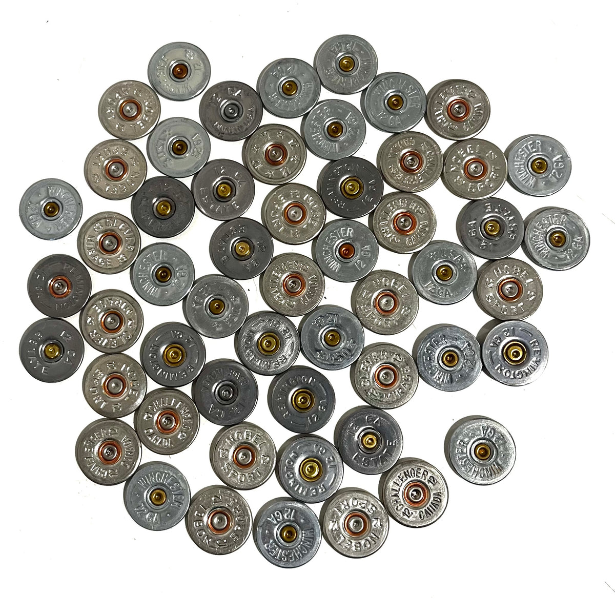 A pile of silver shotgun shell slices with various headstamps and gold or copper primers