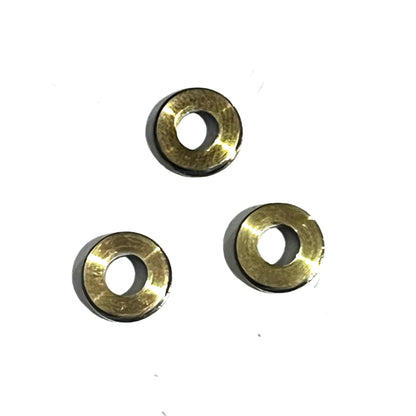 Three spent nickel shell slices with a smooth, unmarked surface, arranged in a triangle on a white background.