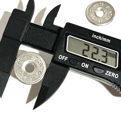 Digital caliper measuring the diameter of a flattened 12 gauge shotgun shell slice at 22.3mm