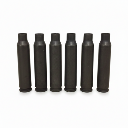 Seven dark gray steel .223/5.56 empty casings standing in a row with a QTY 10 overlay