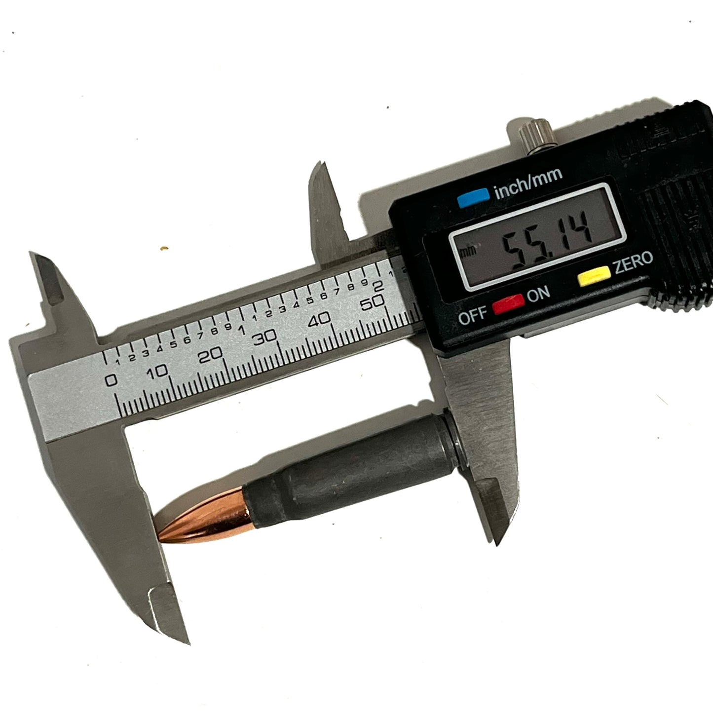 A steel 7.62x39 dummy cartridge measured with a digital caliper showing 55.14 mm.