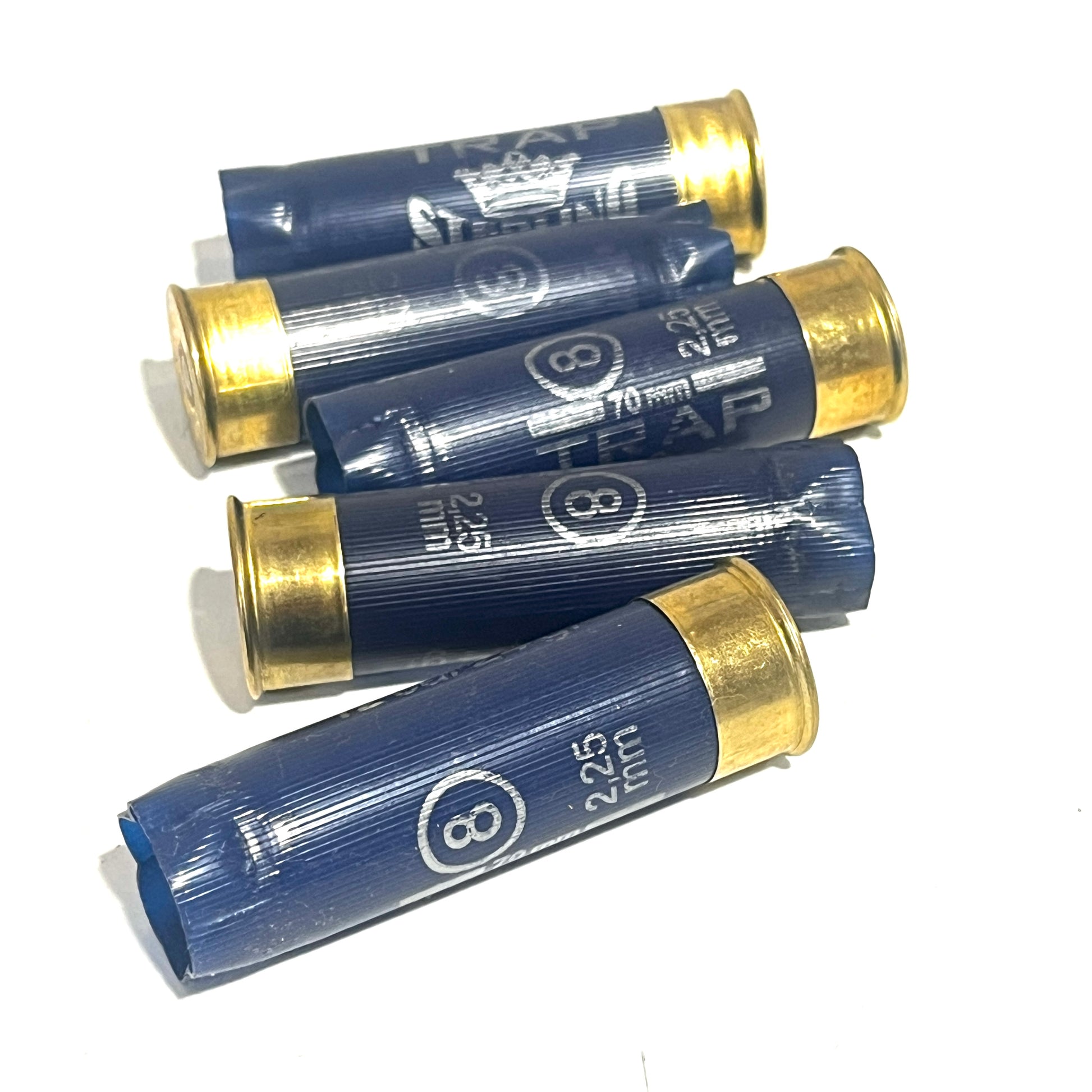 Five navy blue Sterling 12ga shotgun cartridges with crimped gold ends stacked at angles