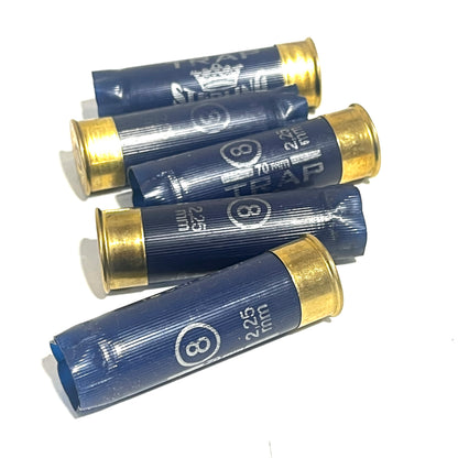 Five navy blue Sterling 12ga shotgun cartridges with crimped gold ends stacked at angles