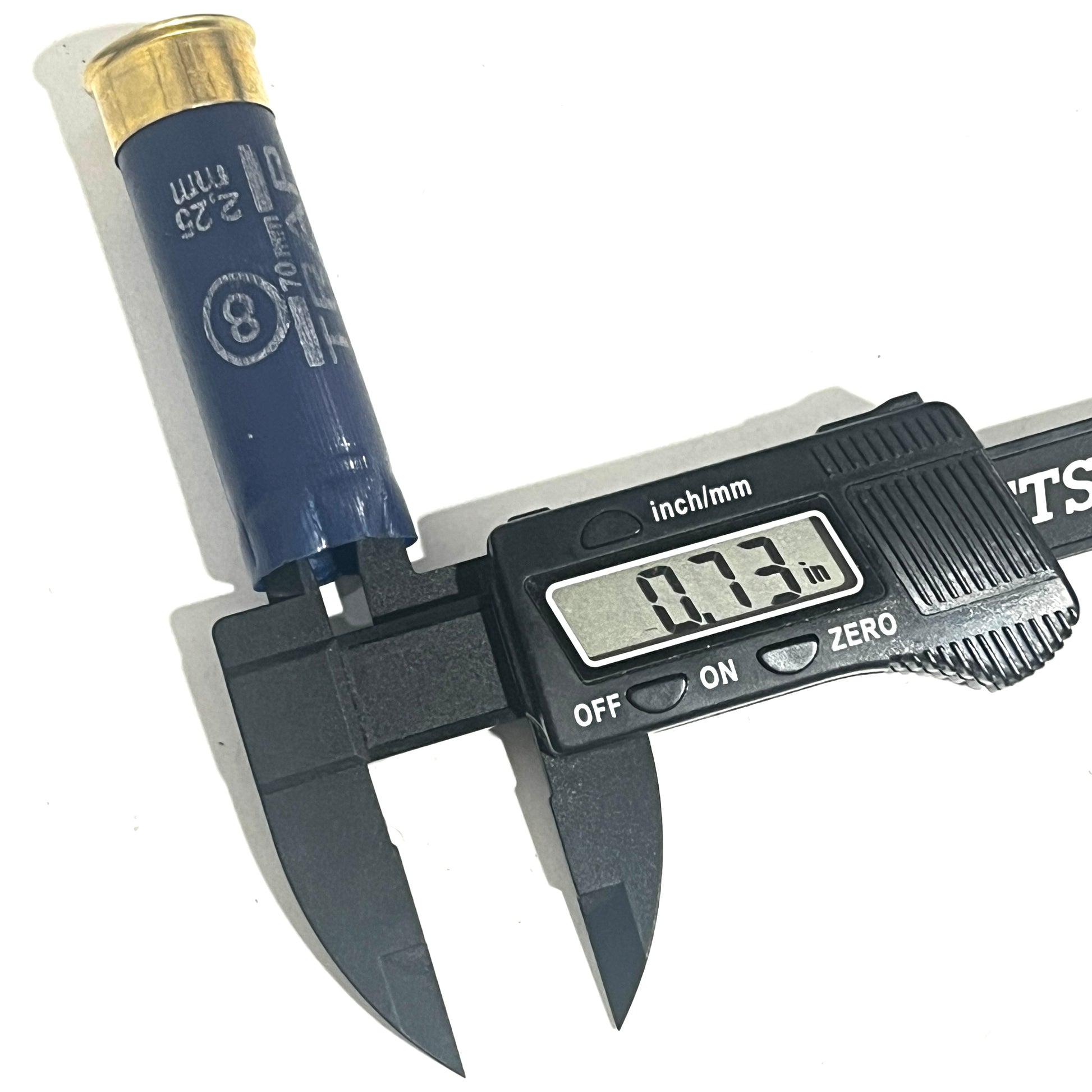 Navy blue Sterling 12ga shotgun shell measured with a digital caliper reading 0.73 inches
