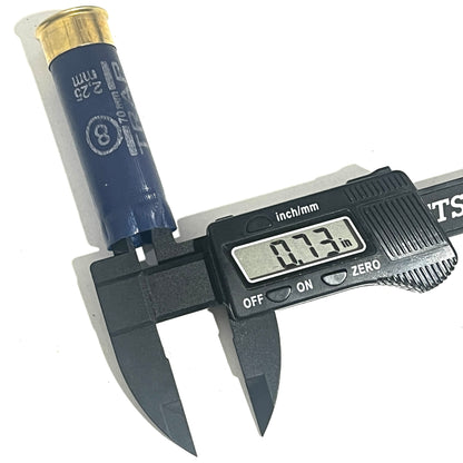 Navy blue Sterling 12ga shotgun shell measured with a digital caliper reading 0.73 inches