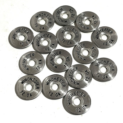 Twelve silver Winchester 12 gauge shotgun shell painted slices arranged in a circular design on a white background.