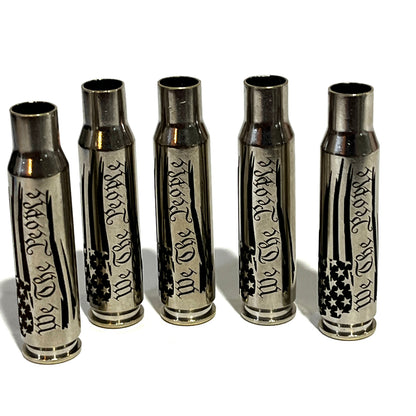 5 nickel .308 WIN cartridges engraved with We The People and a star flag design, standing upright