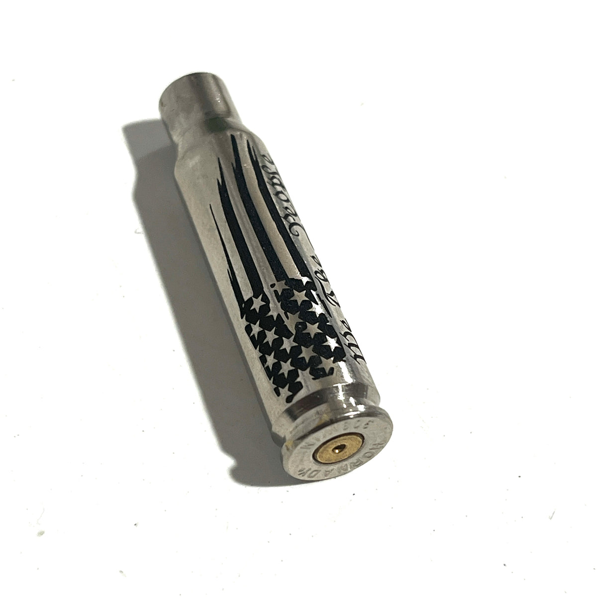 Nickel .308 WIN cartridge engraved with a star flag design, headstamp visible
