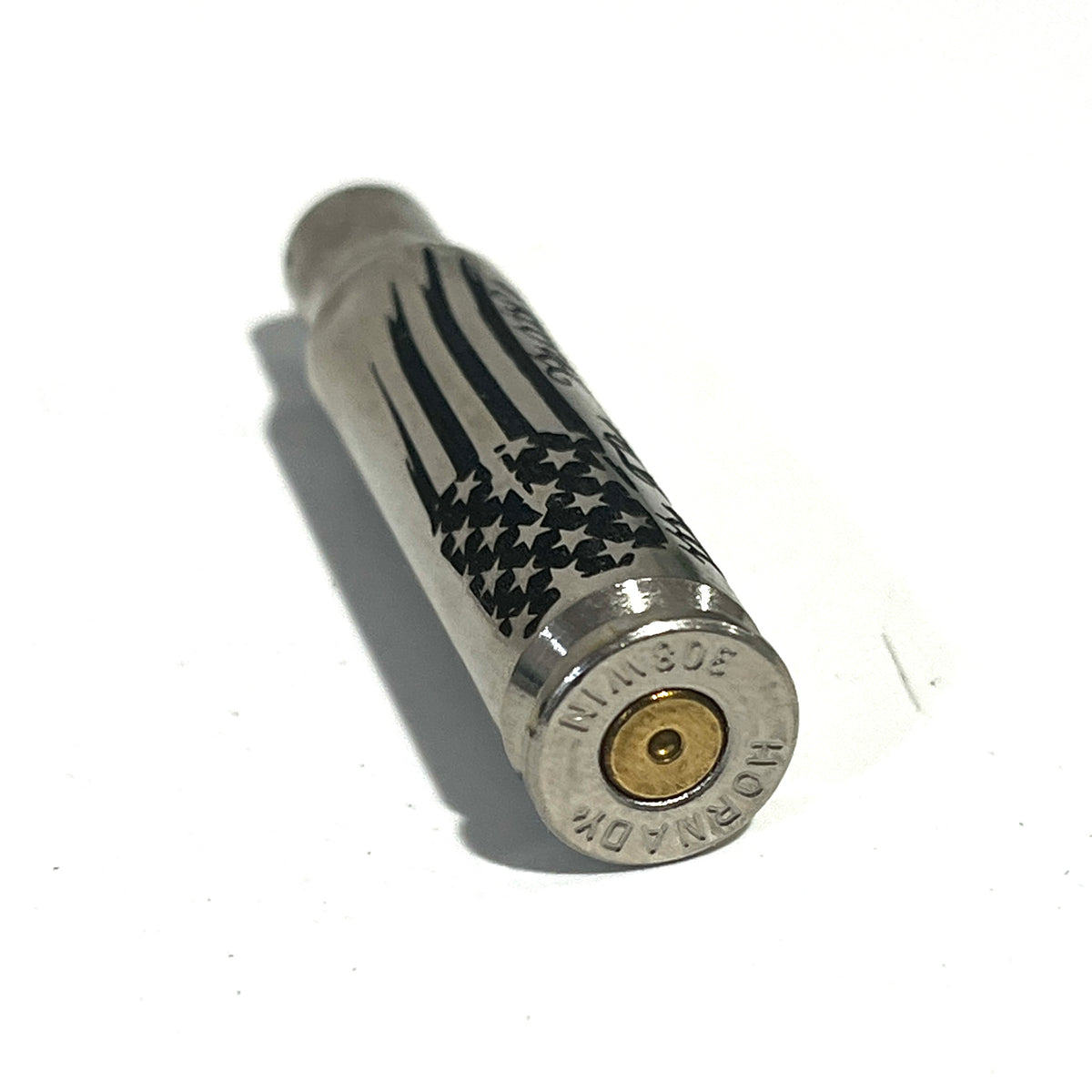 Nickel .308 WIN cartridge engraved with a star flag design, headstamp reading 308 WIN Hornady