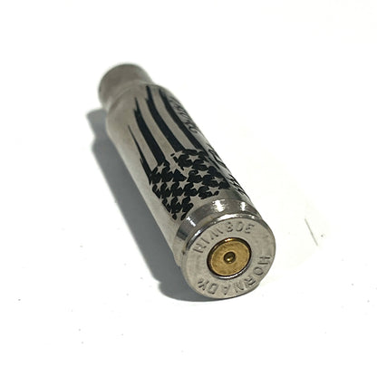 Nickel .308 WIN cartridge engraved with a star flag design, headstamp reading 308 WIN Hornady
