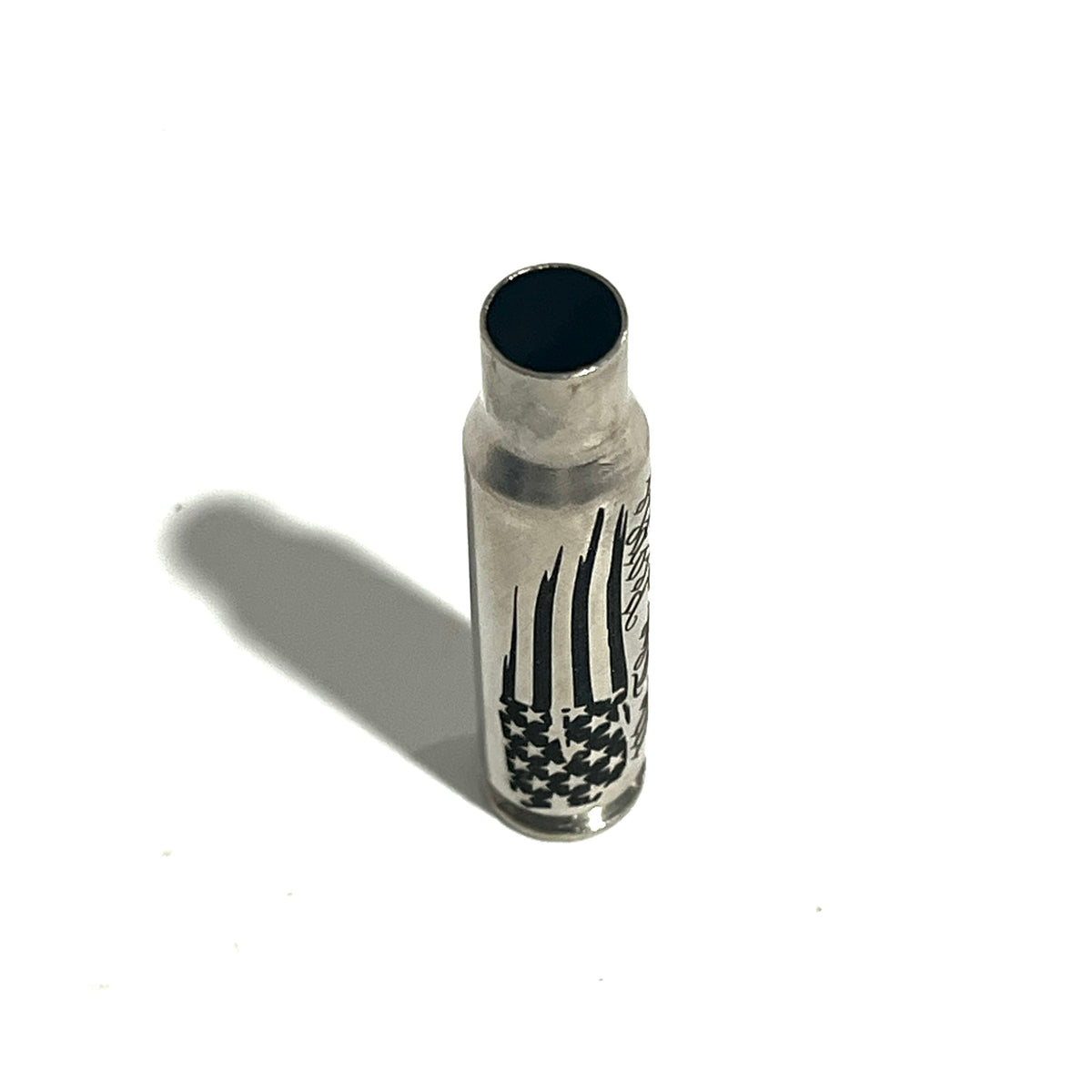 Nickel .308 WIN cartridge engraved with a star flag design, standing on a white background