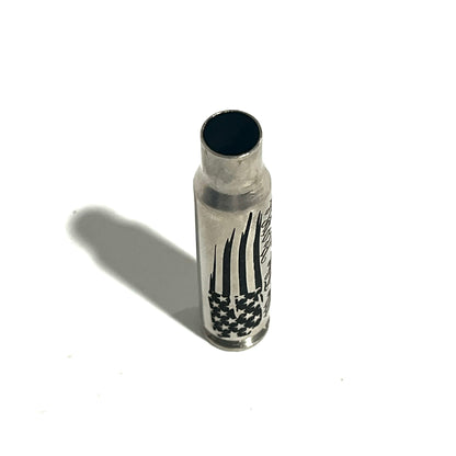 Nickel .308 WIN cartridge engraved with a star flag design, standing on a white background