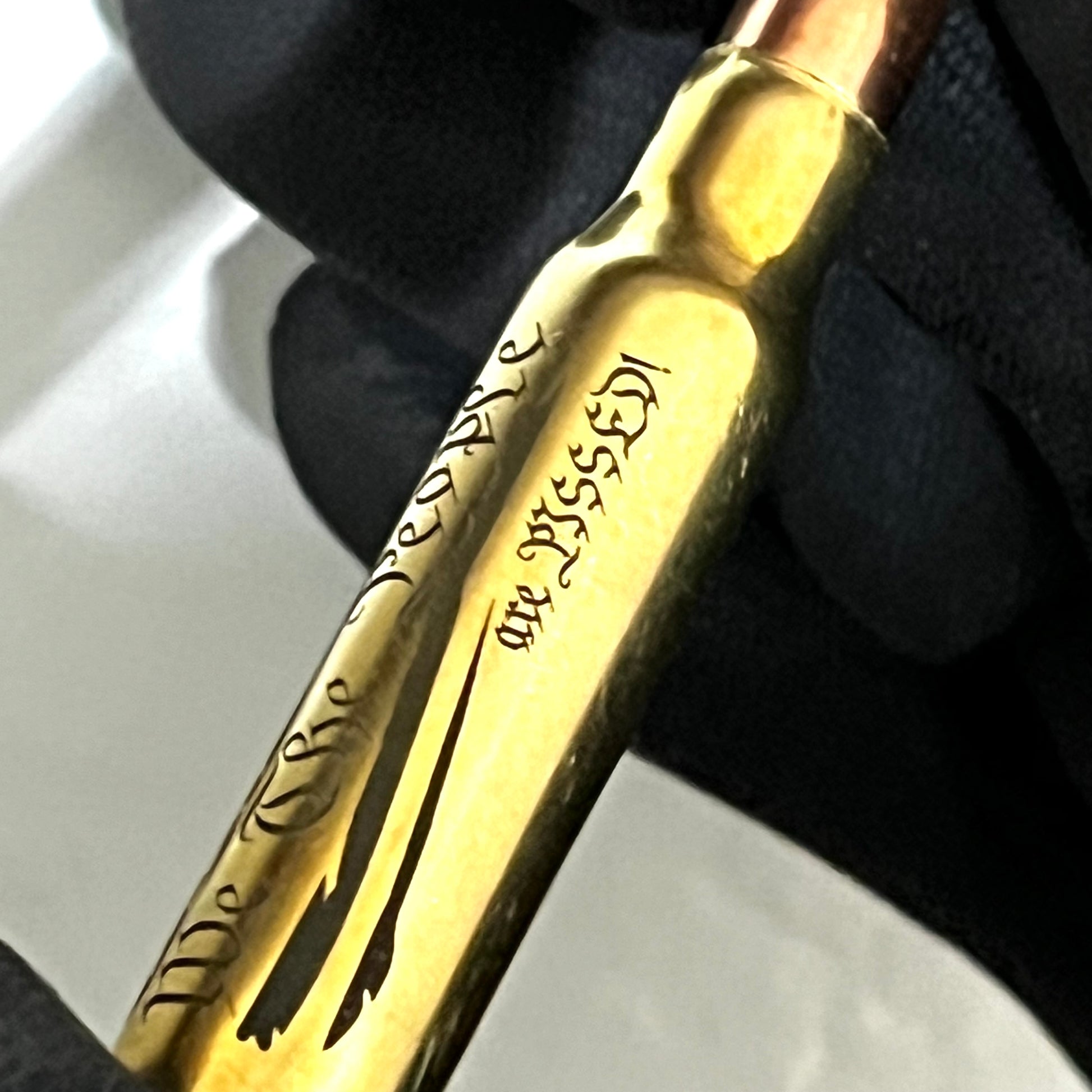 Close-up of a brass .308 WIN cartridge engraved with 'We The People' and a star-and-stripes flag design