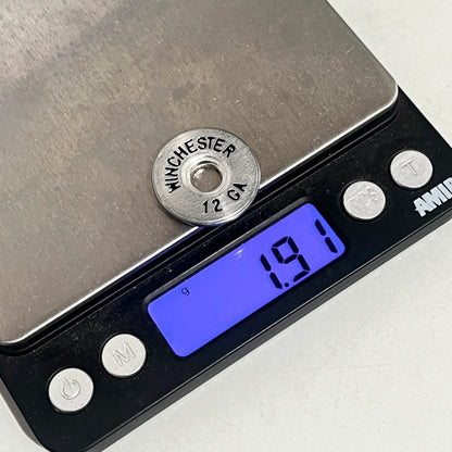 A digital scale weighing a silver Winchester 12 gauge shotgun shell slice displaying 1.91 grams.