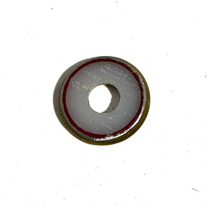 Close-up of a Fiocchi 28 gauge shotgun shell slice with a white and red painted center
