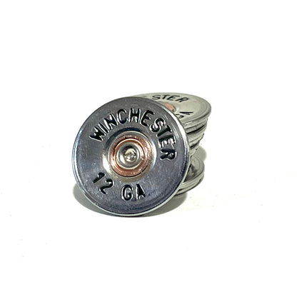 A Winchester 12 gauge painted slice leaning in front of four more stacked slices on a white background.