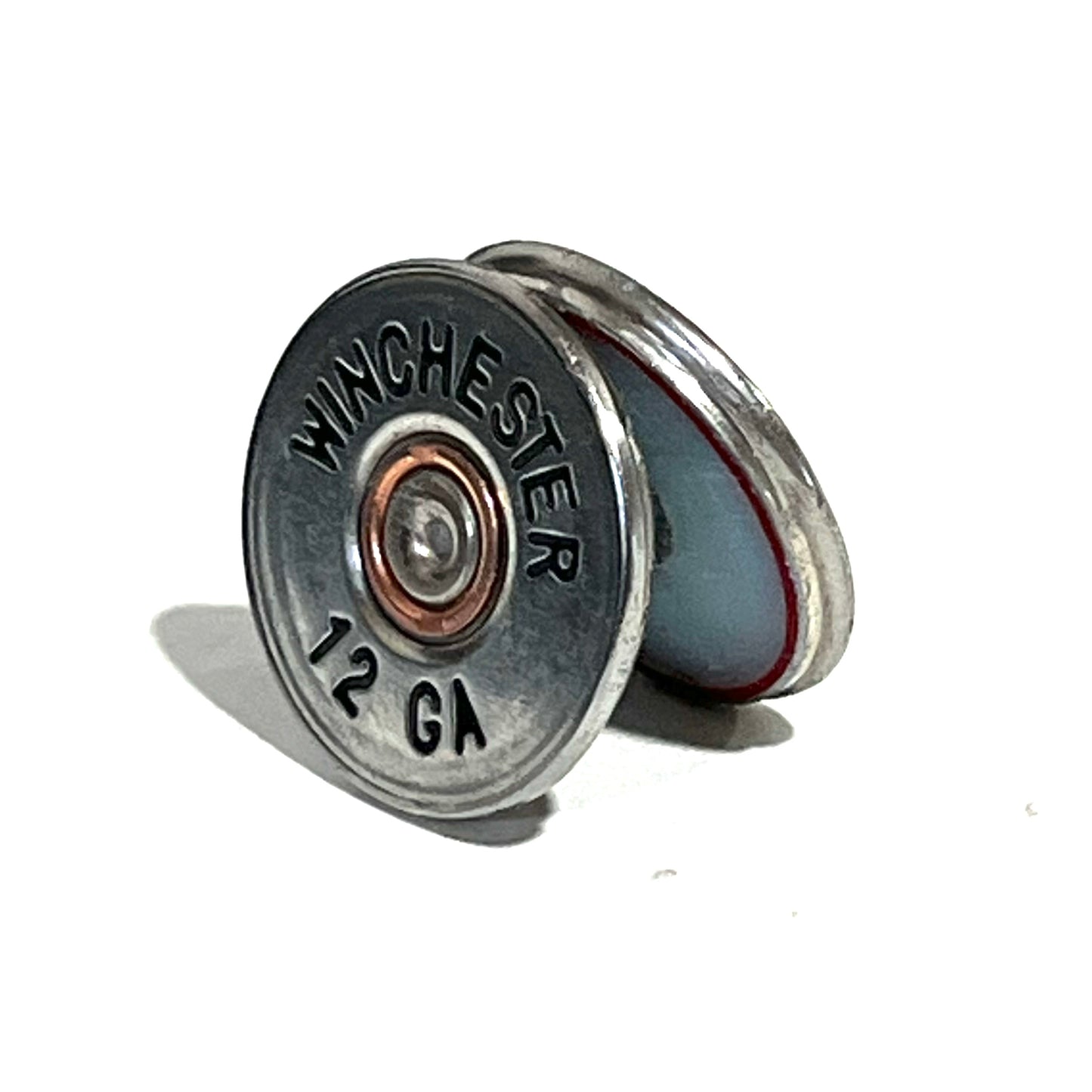 A silver Winchester 12 gauge slice hand painted standing at an angle, showing its headstamp and red-lined cross-section edge.