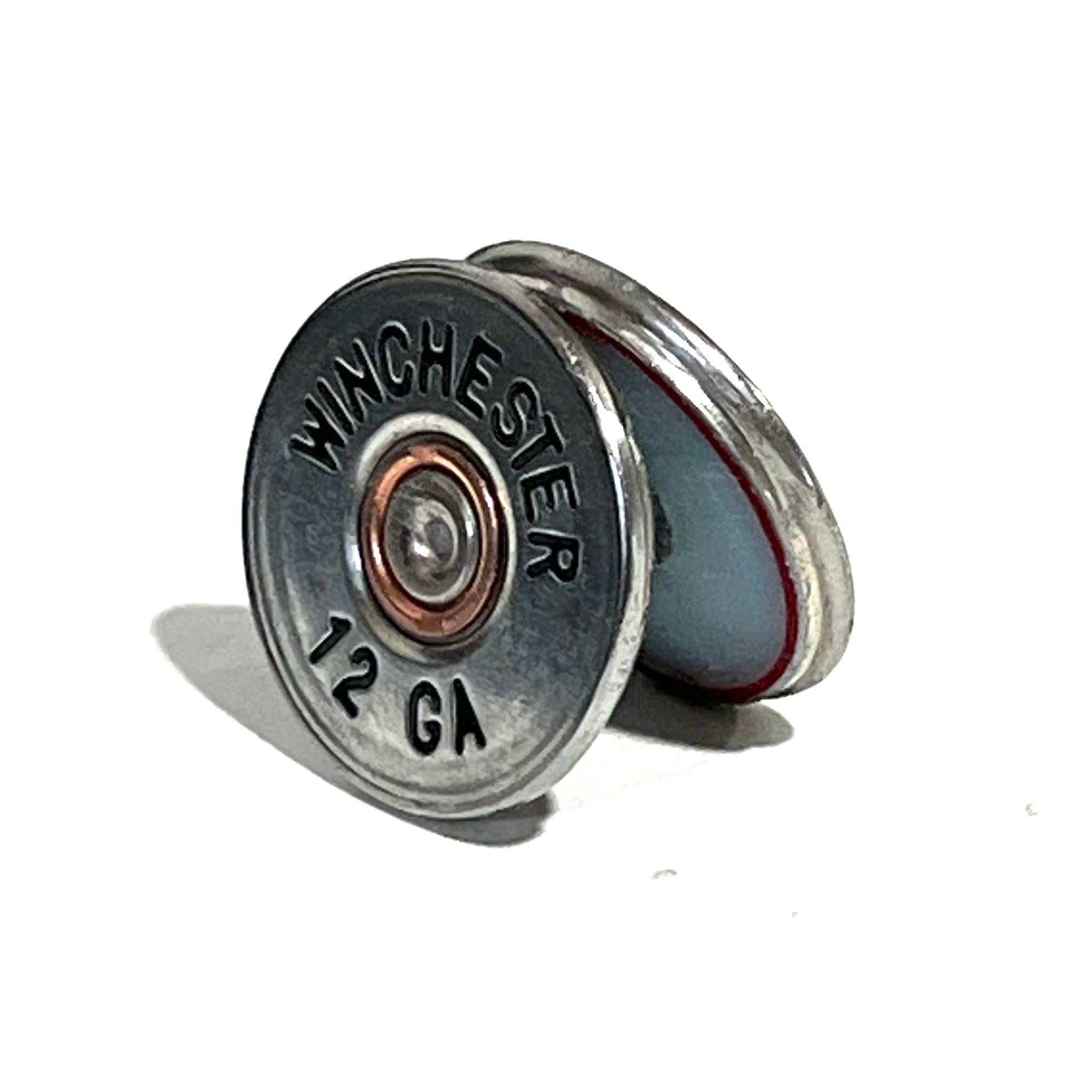 A silver Winchester 12 gauge slice hand painted standing at an angle, showing its headstamp and red-lined cross-section edge.