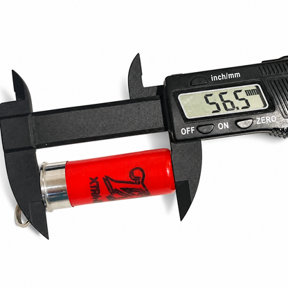 Caliper reading 56.5 mm along the hull of a red once-fired shotshell keychain